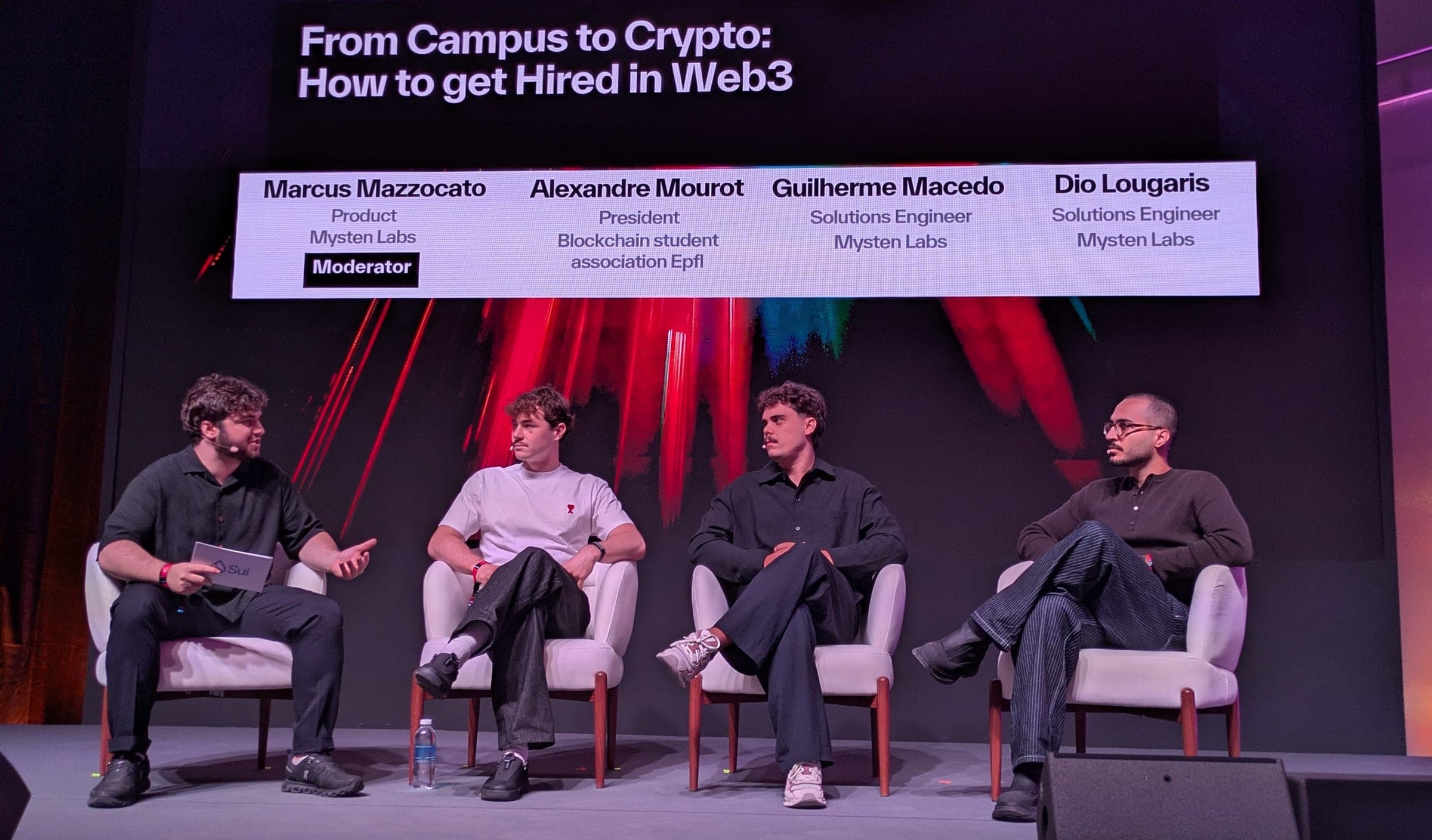 Guilherme on stage with three other speakers in the "From Campus to Crypto: How to get Hired in Web3" panel at Sui Basecamp.